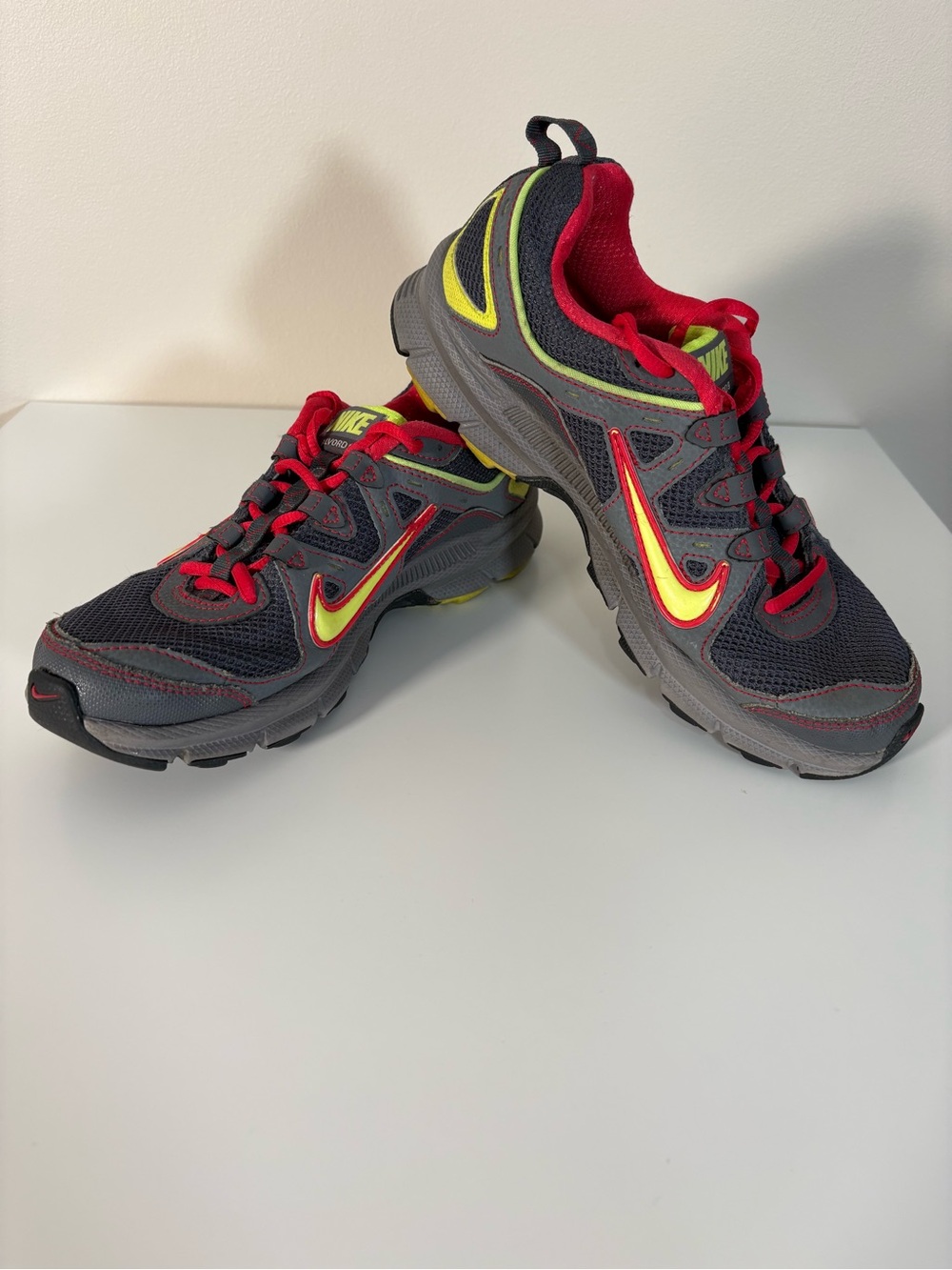 Nike Gray Athletic Sneakers with Red and Yellow Accents
